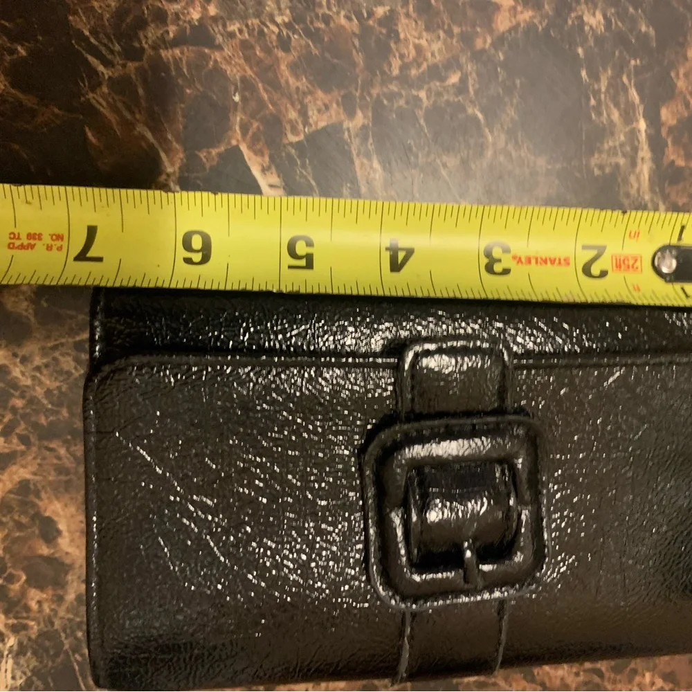 Black RGA trifold wallet with faux buckle detail